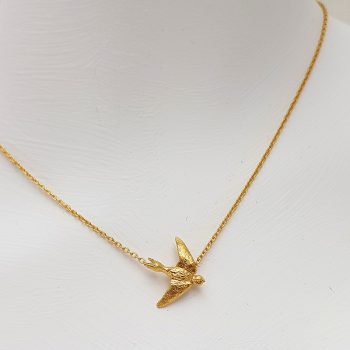 Colgante Porca Miseria golondrina plata bañada en oro